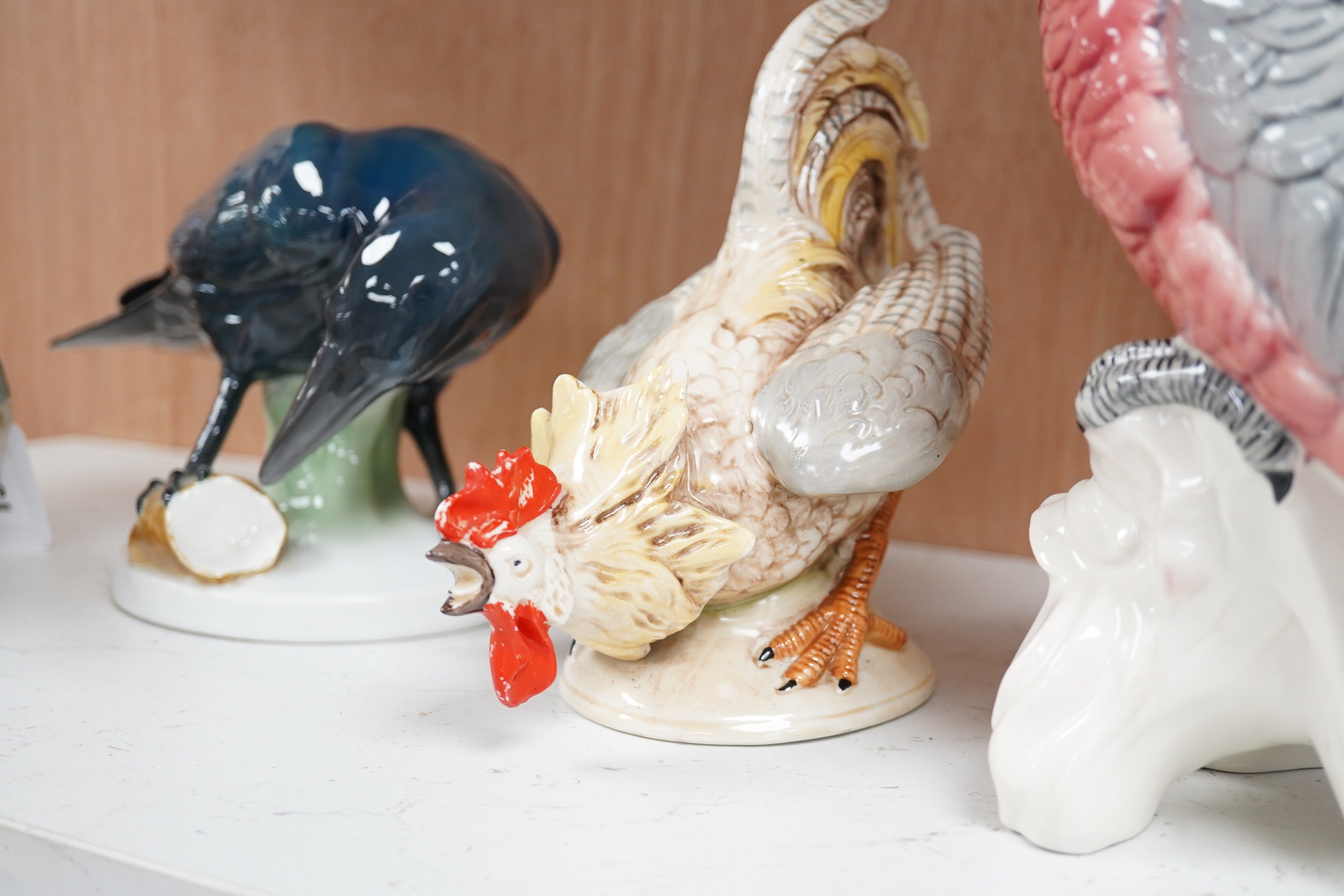 A large Beswick grey parrot, two chickens and a blackbird, parrot 29cm high. Condition - chickens glazing worn